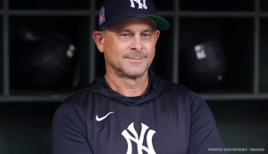 New York Yankees manager Aaron Boone looking on from the dugout during an MLB game